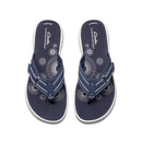 Pair of navy blue sandals with white patterns on a white background