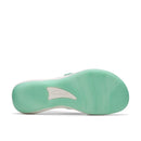 Mint green sandal sole with a brand logo on a white background