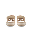 Pair of beige sandals on a white background