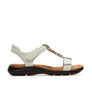 White sandal with a black sole on a white background