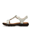 White sandal with brown sole on a white background