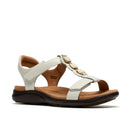 White sandal with brown sole on a white background