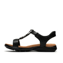 Black sandal with a brown insole on a white background