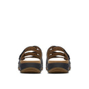 Pair of black sandals with brown soles on a white background