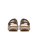 Pair of sandals with brown straps and beige soles on a white background