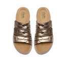 Pair of bronze sandals with 'Clarks' branding on a white background