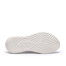 White sneaker sole with brand logo on a white background