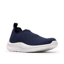 Navy slip-on shoe with white sole on a white background