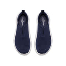 Pair of navy slip-on shoes with white soles on a white background