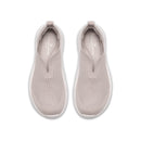 Pair of light gray slip-on sneakers on a white background