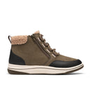A mid-calf winter sneaker boot in olive green suede and black leather, featuring a tan faux-fur collar, brown laces, and a thick cream-colored midsole.