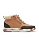 A mid-height ankle boot in tan suede and black leather, featuring a cream sherpa lining at the collar, matching tan laces, and a thick white and tan sole.