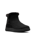 A single black ankle boot with a plush black faux-fur trim at the collar, shown from a three-quarters angle on a white background.