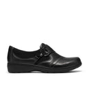 A black slip-on wedge shoe with a decorative strap and small silver buckle detail, shown in a side profile on a white background.