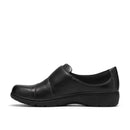 A black slip-on leather shoe with a rounded toe and low platform sole, shown in a side profile on a white background.
