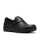 A single black slip-on shoe with decorative stitching and a small hanging tag, shown from a side angle on a white background.