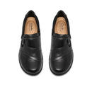 A pair of black leather slip-on shoes with decorative stitching and side buckle details, shown from a top-down view on a white background. The insoles display the Clarks Collection logo.