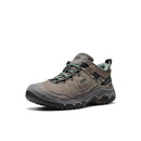 Black and green hiking shoe with red accents on a white background