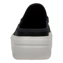 Black slip-on shoe with a white sole on a white background