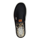 Black slip-on sneaker with leopard print sole on a white background
