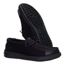 Black casual shoes with textured sole on a white background