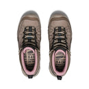 Pair of brown hiking boots with pink interior on a white background