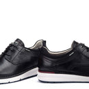 Pair of black shoes with white soles on a white background