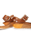 Brown sandals with cork sole on a white background