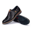 Black leather shoes with red accents on a white background
