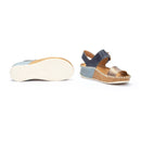 Navy sandal with cork sole on a white background