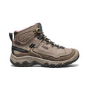 Brown hiking boot with visible KEEN logo on a white background
