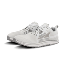 A pair of white and light gray athletic sneakers shown from a three-quarters angle on a clean white background.