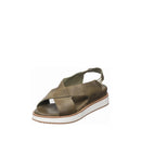 Green sandal with a white sole on a white background