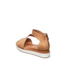 Tan sandal with white sole on a white background