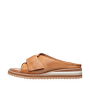 Tan sandal with a white sole on a white background
