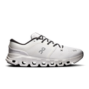 White athletic shoe with black laces on a white background