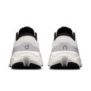 White running shoes with black soles on a white background