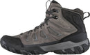 Gray hiking boot with black sole on a white background