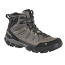 Gray hiking boot with black sole on a white background