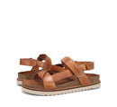 Pair of brown sandals on a white background