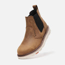 Brown Chelsea boot with white sole on a light gray background