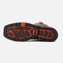 Close-up of a shoe sole with red and black pattern on a light gray background