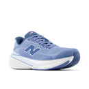 Blue running shoe with white sole on a white background
