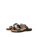 Pair of black sandals with brown soles on a white background