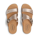 Pair of tan sandals with metallic straps on a white background