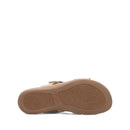 Tan sandal with a textured sole on a white background