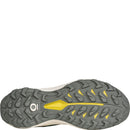 Close-up of a shoe sole with a textured pattern and yellow accents on a white background