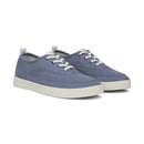 Pair of blue sneakers with white soles on a white background