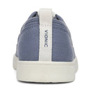 Blue Vionic sneaker with white sole on a white background