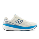 White running shoe with blue sole on a white background